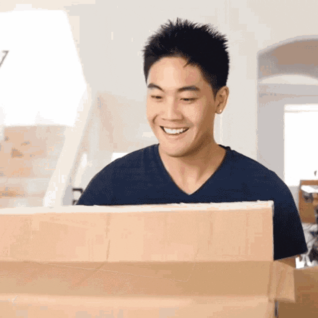 Social media personality, Ryan Higa, with a carton box